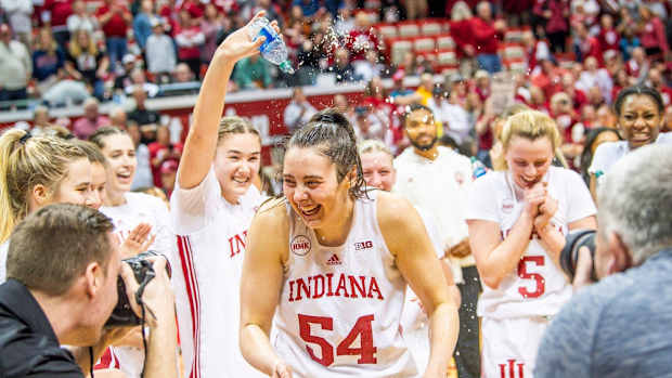 Indiana's Mackenzie Holmes (54) is splashed with water by teammates after the second half of the Indiana versus Purdue women's basketball game at Simon Skjodt Assembly Hall on Sunday, Feb. 11, 2024. Holmes become the all-time leading scorer in the school's history with her 17 points in the game.